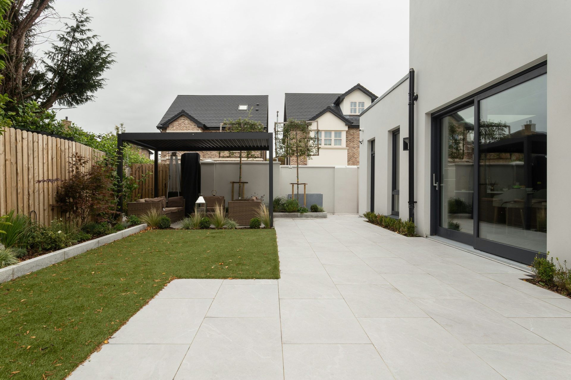 a house with a large yard and a covered patio